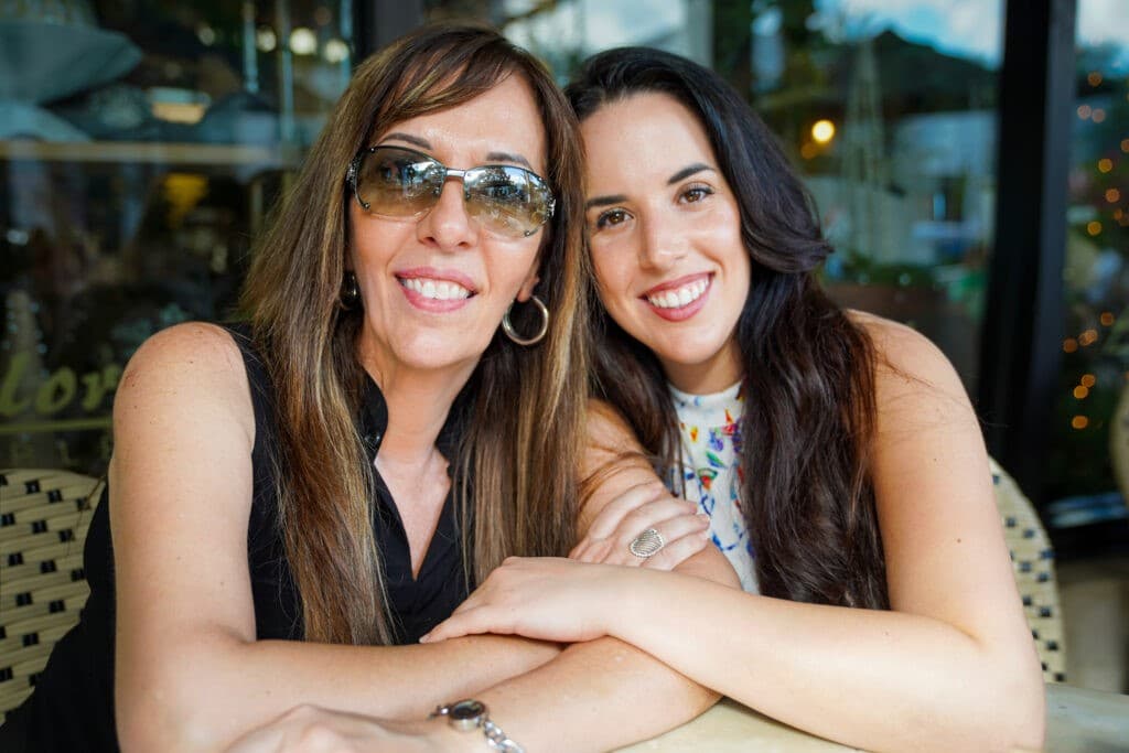 Rocki and Filomena Maimone sharing a laugh together at a cafe table